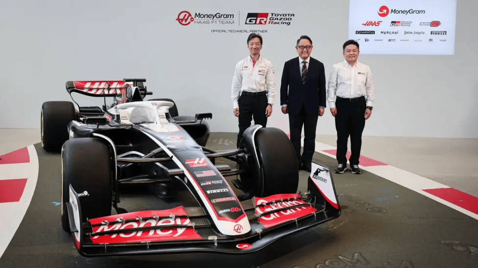 Haas team principal Ayao Komatsu (left) with Akio Toyoda, chairman of Toyota Motor Corporation (centre) and Tomoya Takahashi, president of Toyota Gazoo Racing