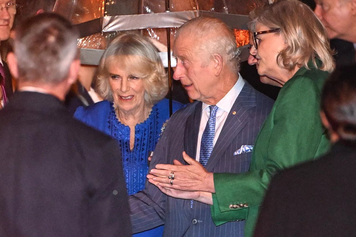 King Charles and Queen Camilla are greeted on their arrival at Sydney airport on Oct. 18, 2024