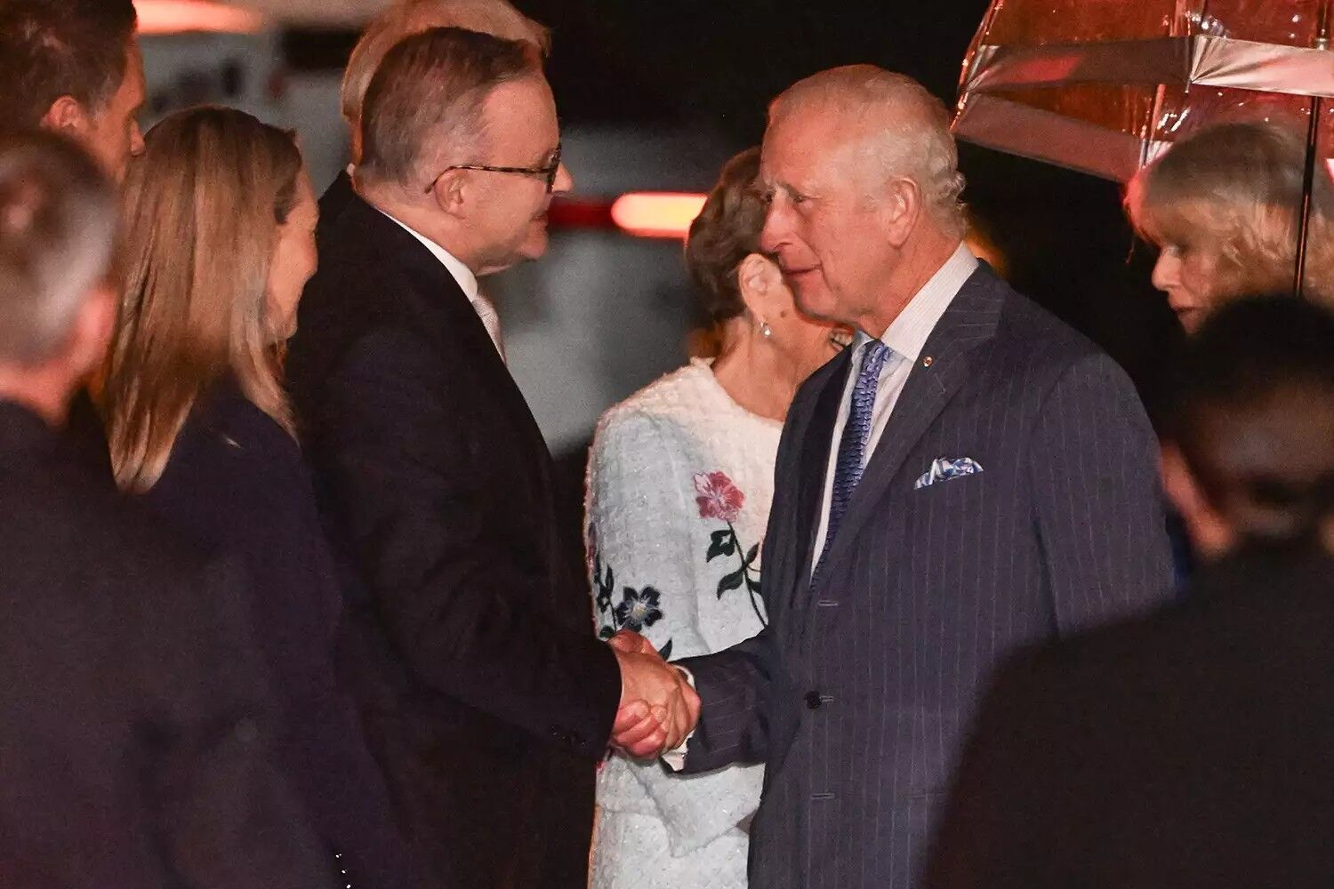 Australia's Prime Minister Anthony Albanese (L) welcomes Britain's King Charles and Queen Camilla to Australia on Oct. 18, 2024