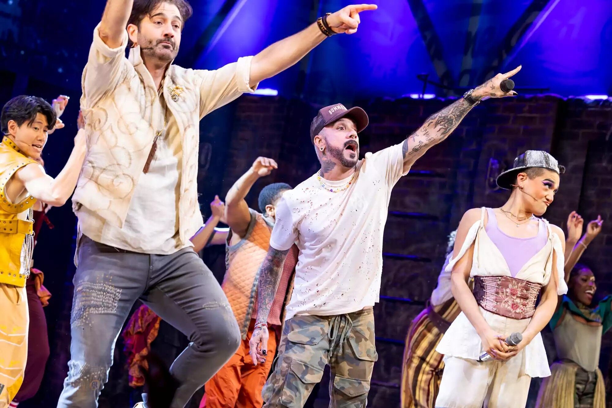 AJ McLean (center) performing with the cast of '& Juliet' on Broadway.