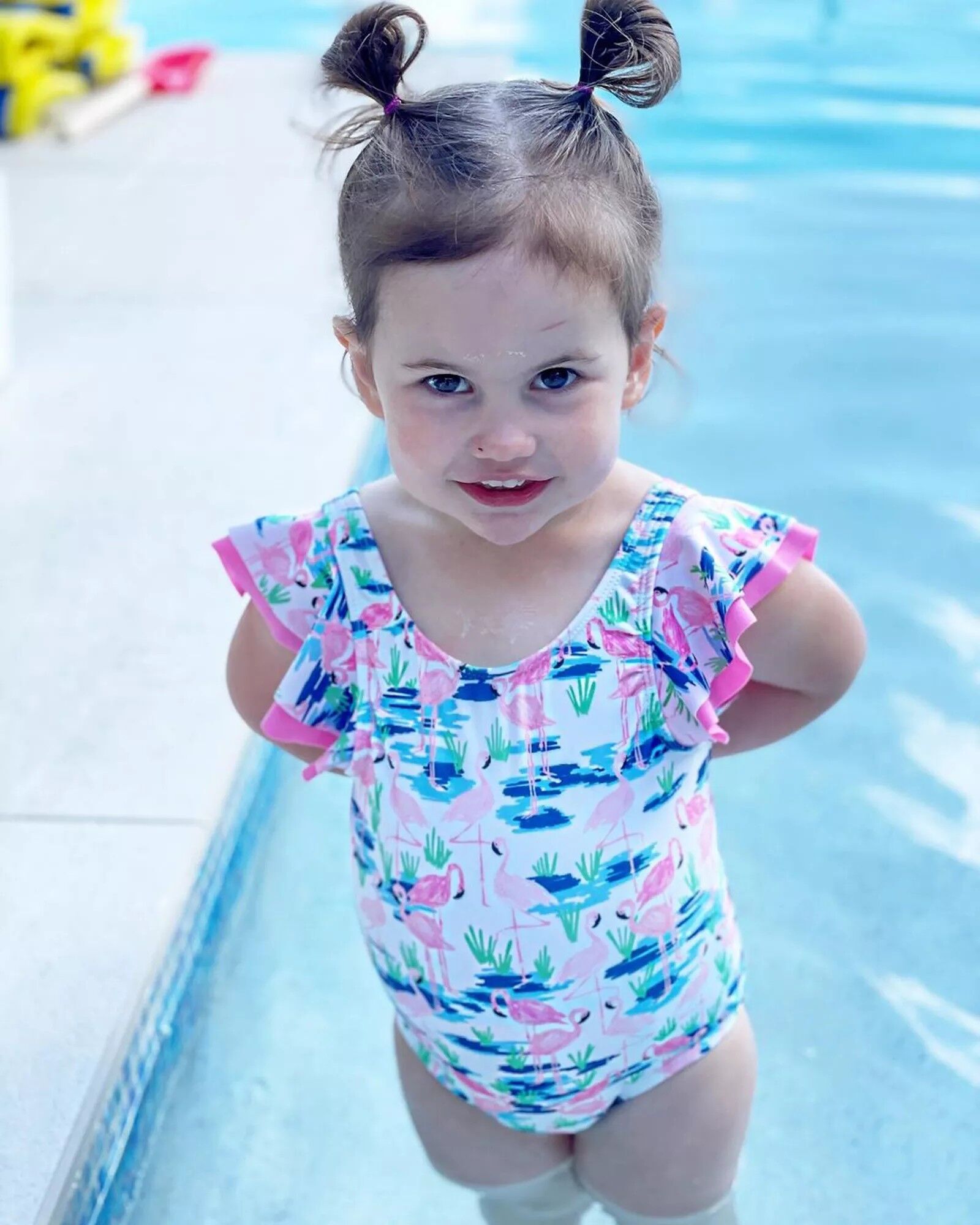 Shawn Johnson and Andrew East's daughter Drew Hazel East in a pool.