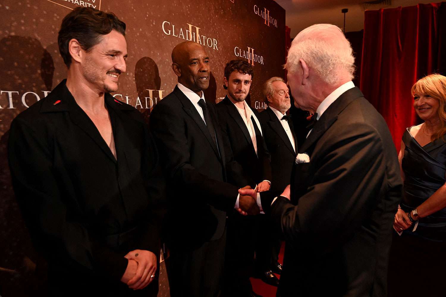 Denzel Washington meeting King Charles the Royal Film Performance of ''Gladiator II'' at ODEON Luxe Leicester Square in London