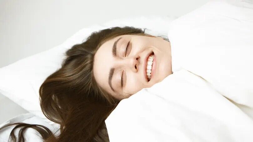 10 Spiritual Meanings of Laughing in Your Sleep