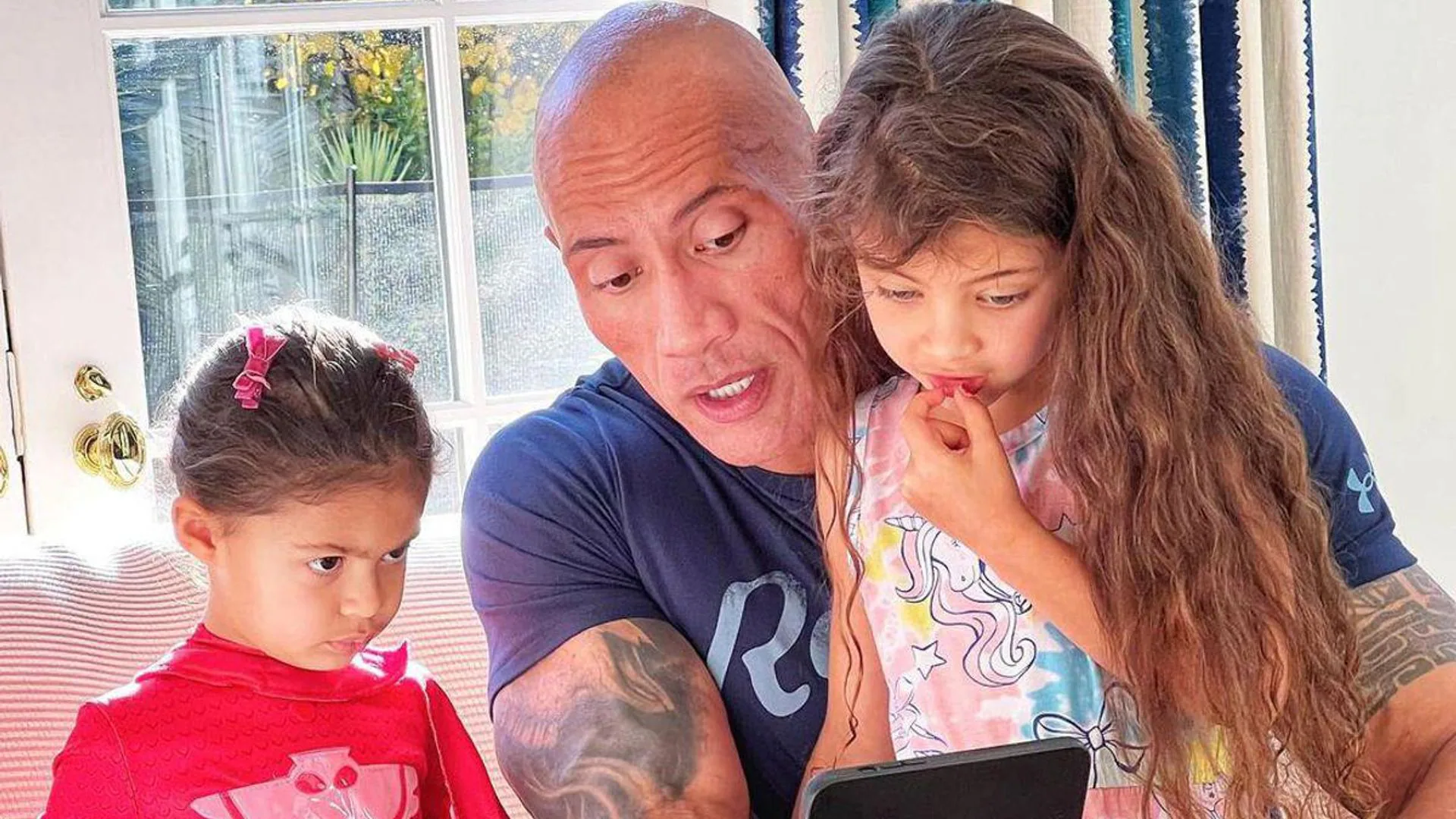 Dwayne Johnson and his daughters