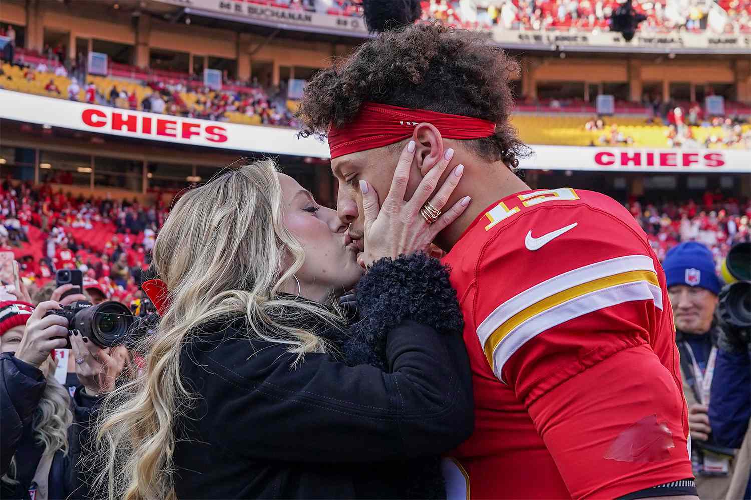 Brittany Mahomes kisses husband Patrick Mahomes during his game with the Kansas City Chiefs on Nov. 29.