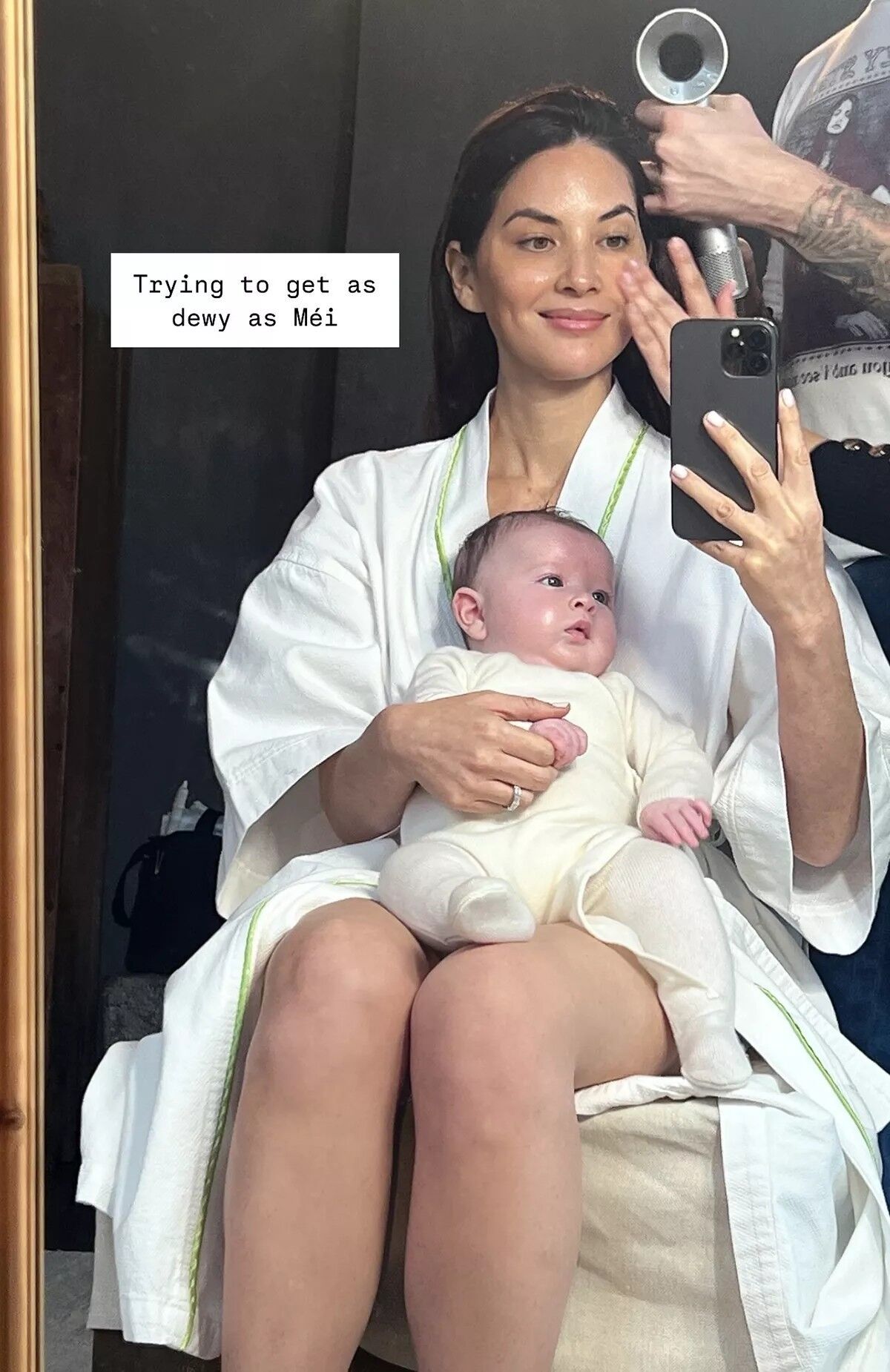 Olivia Munn gets ready with daughter Méi.