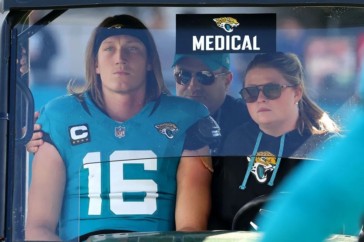 Quarterback Trevor Lawrence #16 of the Jacksonville Jaguars is taken off the field in a medical cart during the second quarter of a game against the Houston Texans on December 01, 2024 in Jacksonville, Florida