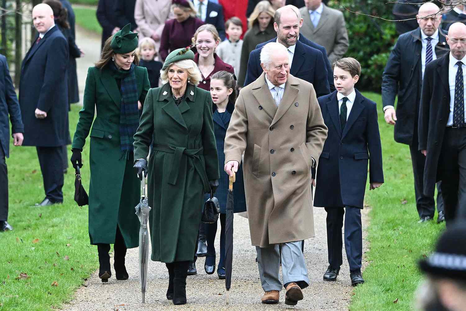 Queen Camilla and King Charles lead the royal family's walk to church at Sandringham on Dec. 25, 2024.