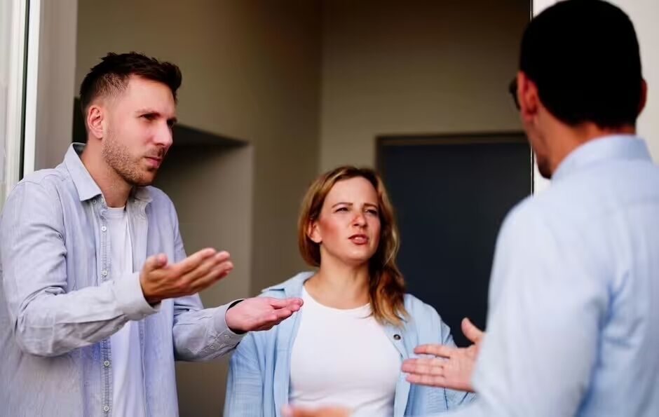 Two men and woman arguing