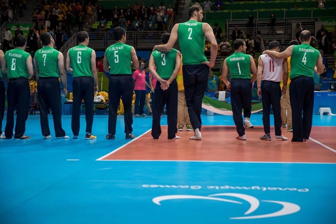 Mehrzad (No. 2) stands with his Iranian teammates