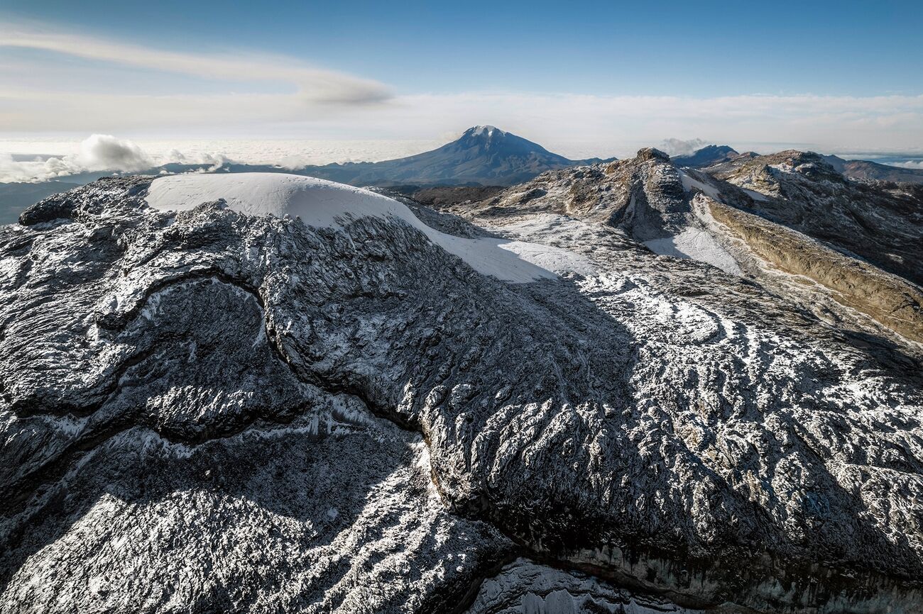 Retreat of high-altitude tropical glaciers: indicators of changing global climate impact on ice