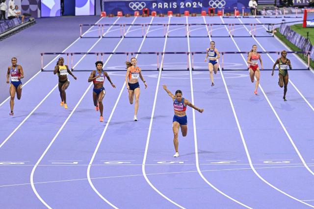 Sydney Mclaughlin-Levrone crosses the finish line