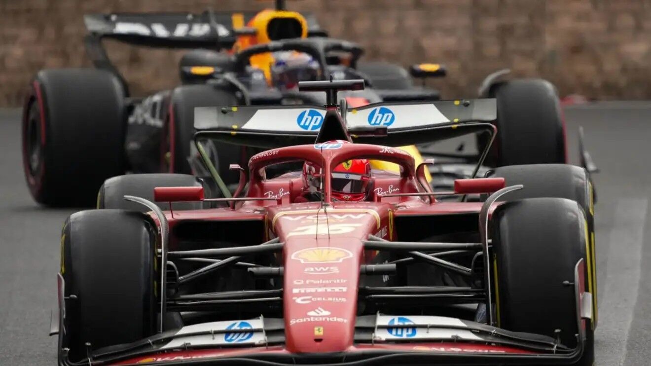 Charles Leclerc leads Max Verstappen around the Baku street circuit