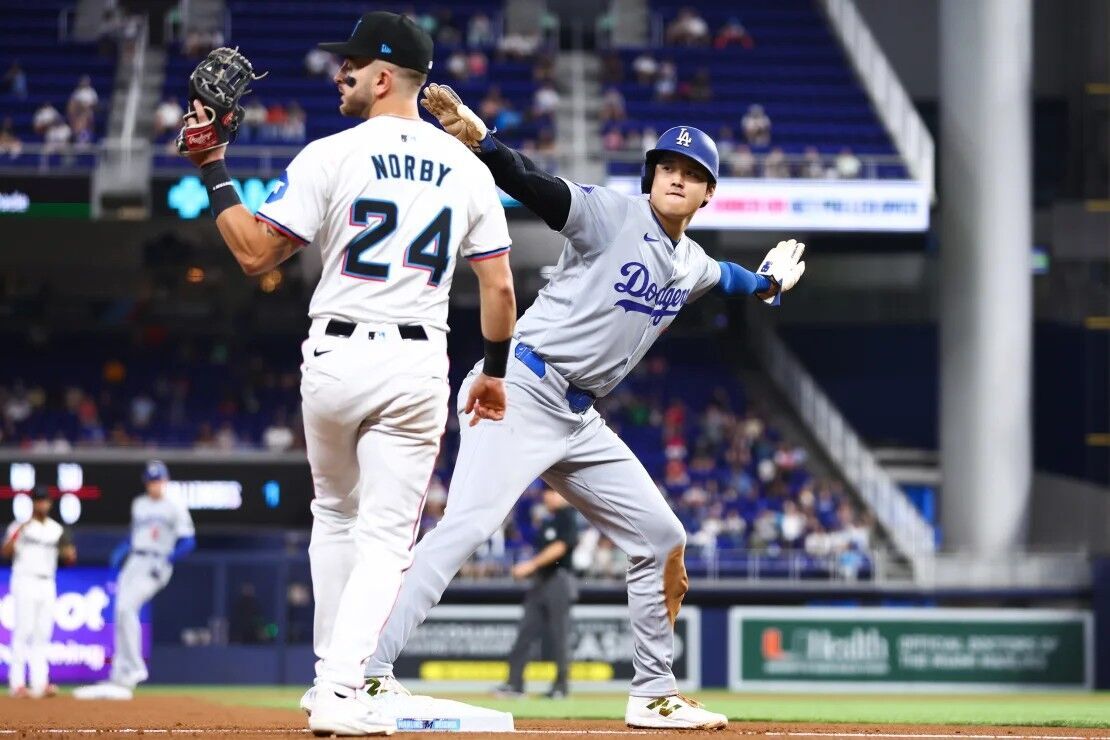 Ohtani celebrates stealing his 50th base of the season.