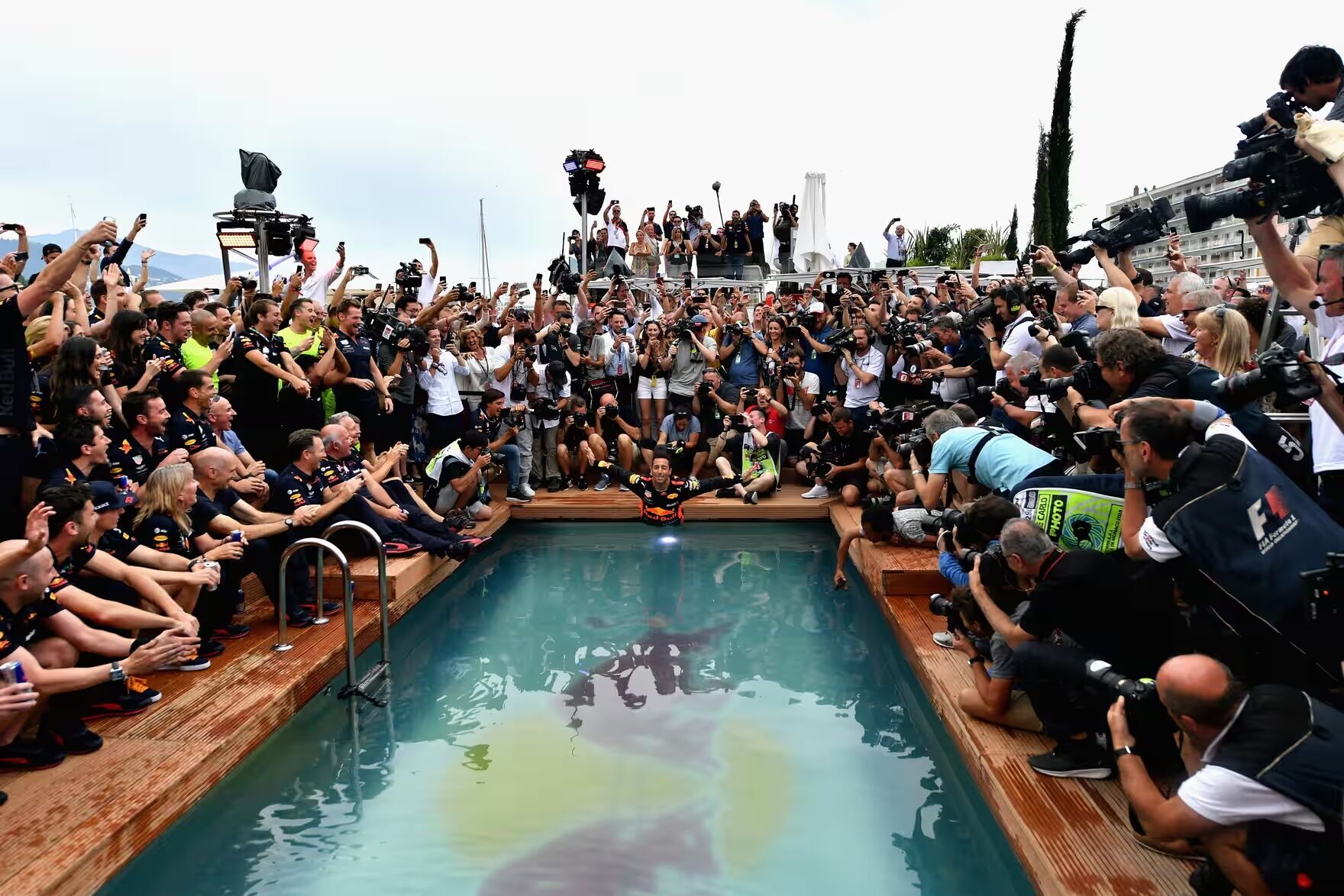 Ricciardo performs a swan dive into a pool after winning the Monaco GP in 2018.