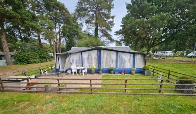 The caravan has a large awning