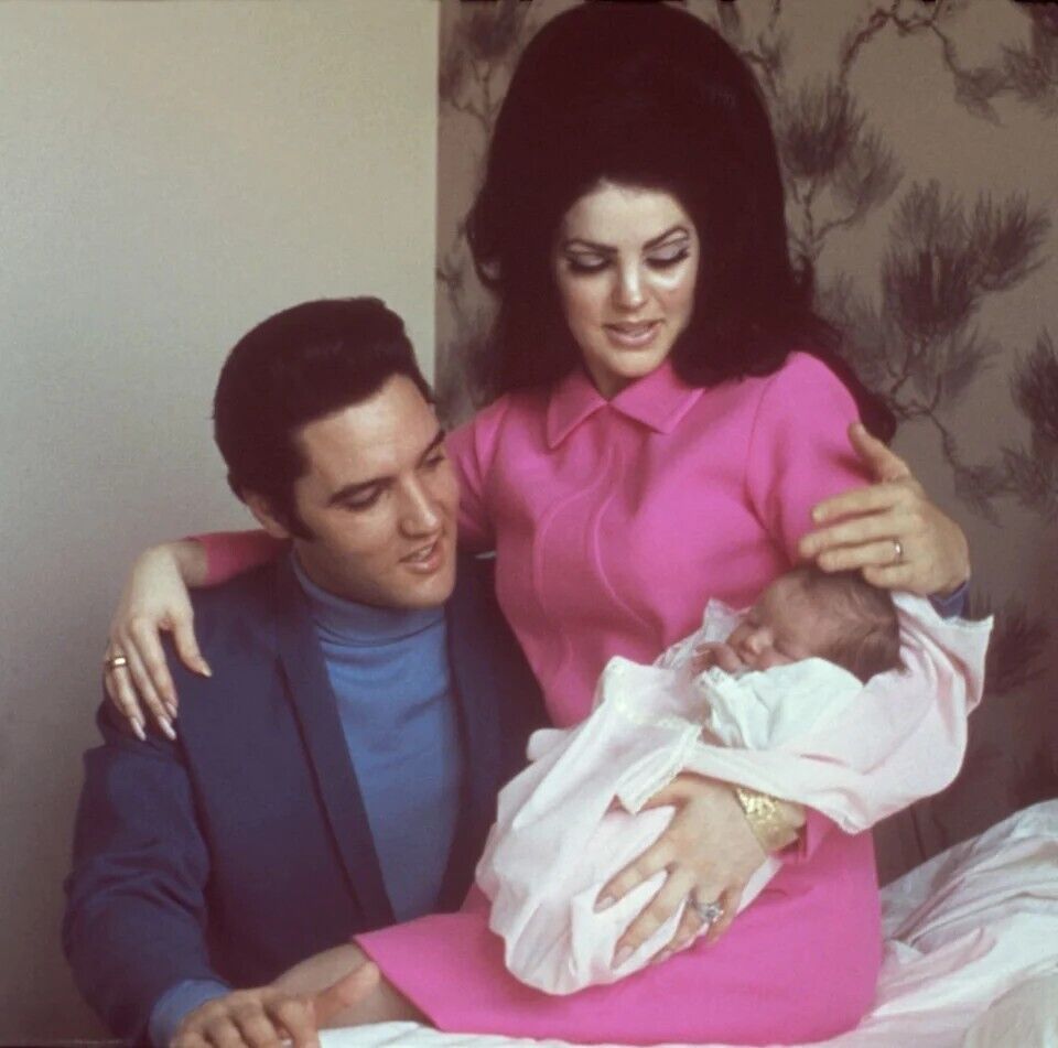 Lisa Marie with her parents in 1968, four days after her birth