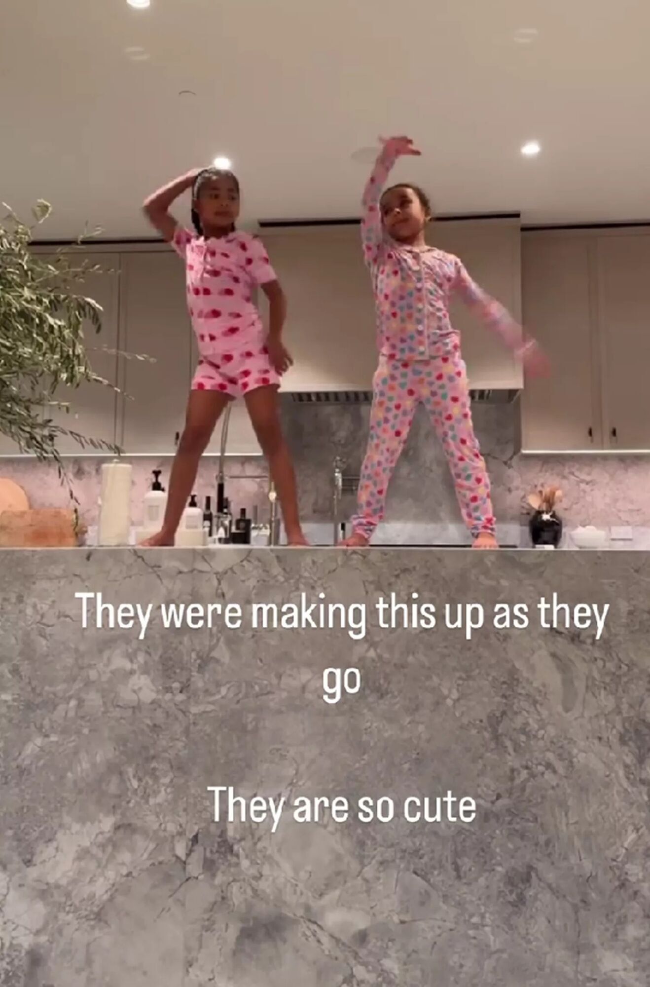 True Thompson and Dream Kardashian dancing.