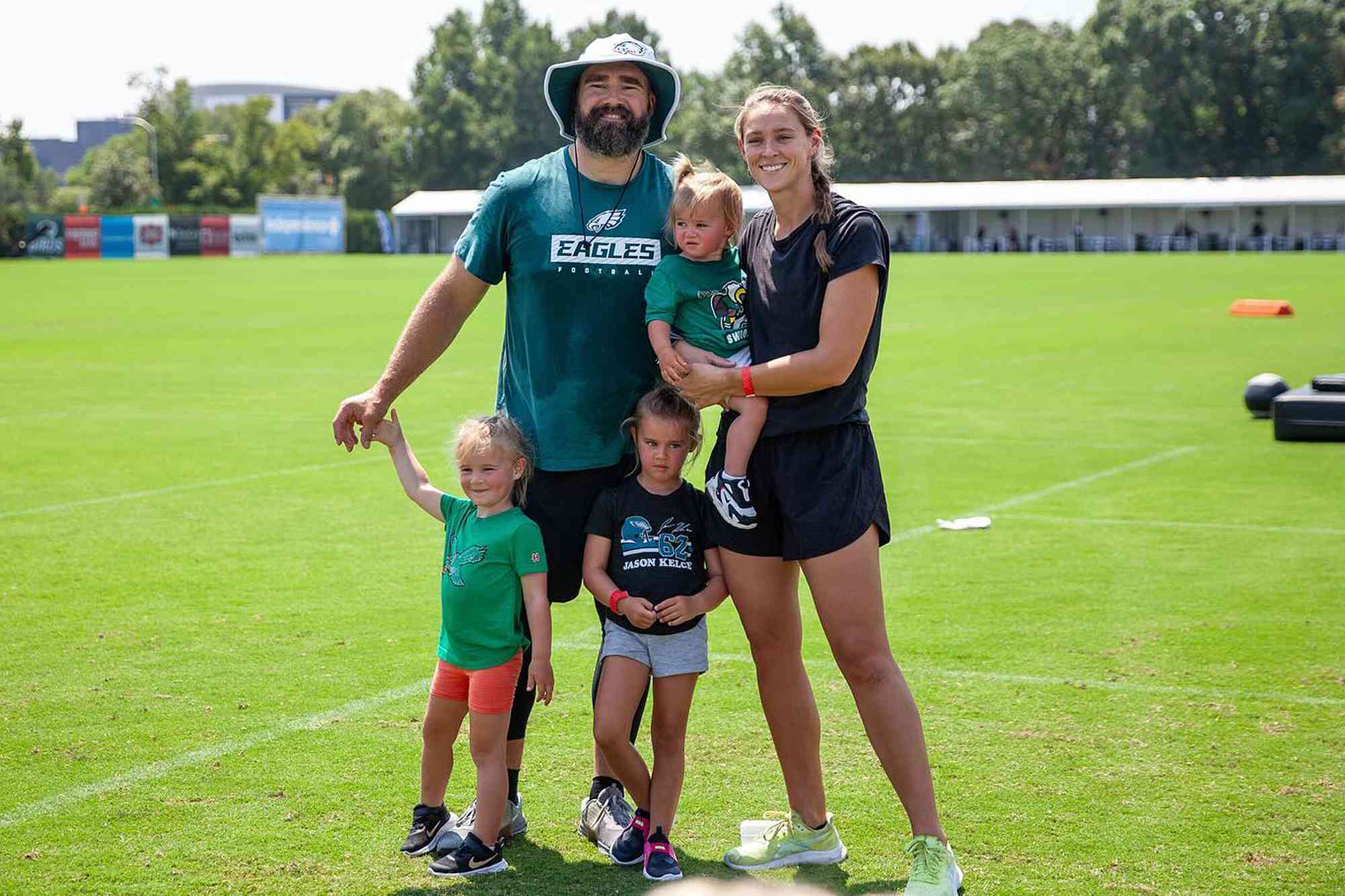 Kylie Kelce and Jason Kelce pose with their three daughters Wyatt, Elliotte and Bennett.