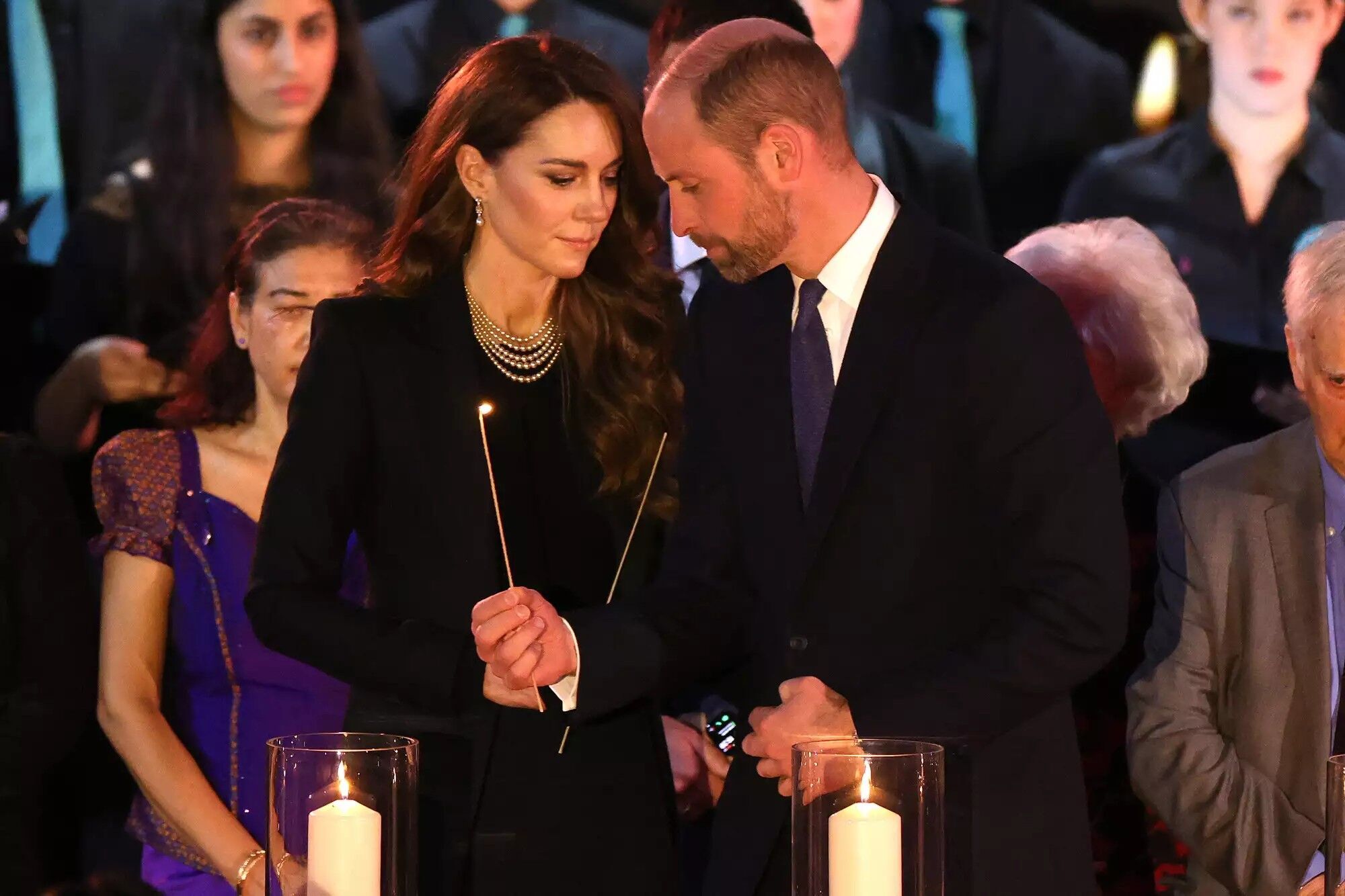 Catherine, Princess of Wales and Prince William, Prince of Wales light candles during a ceremony commemorating Holocaust Memorial Day on Jan. 27, 2025 in London, England.