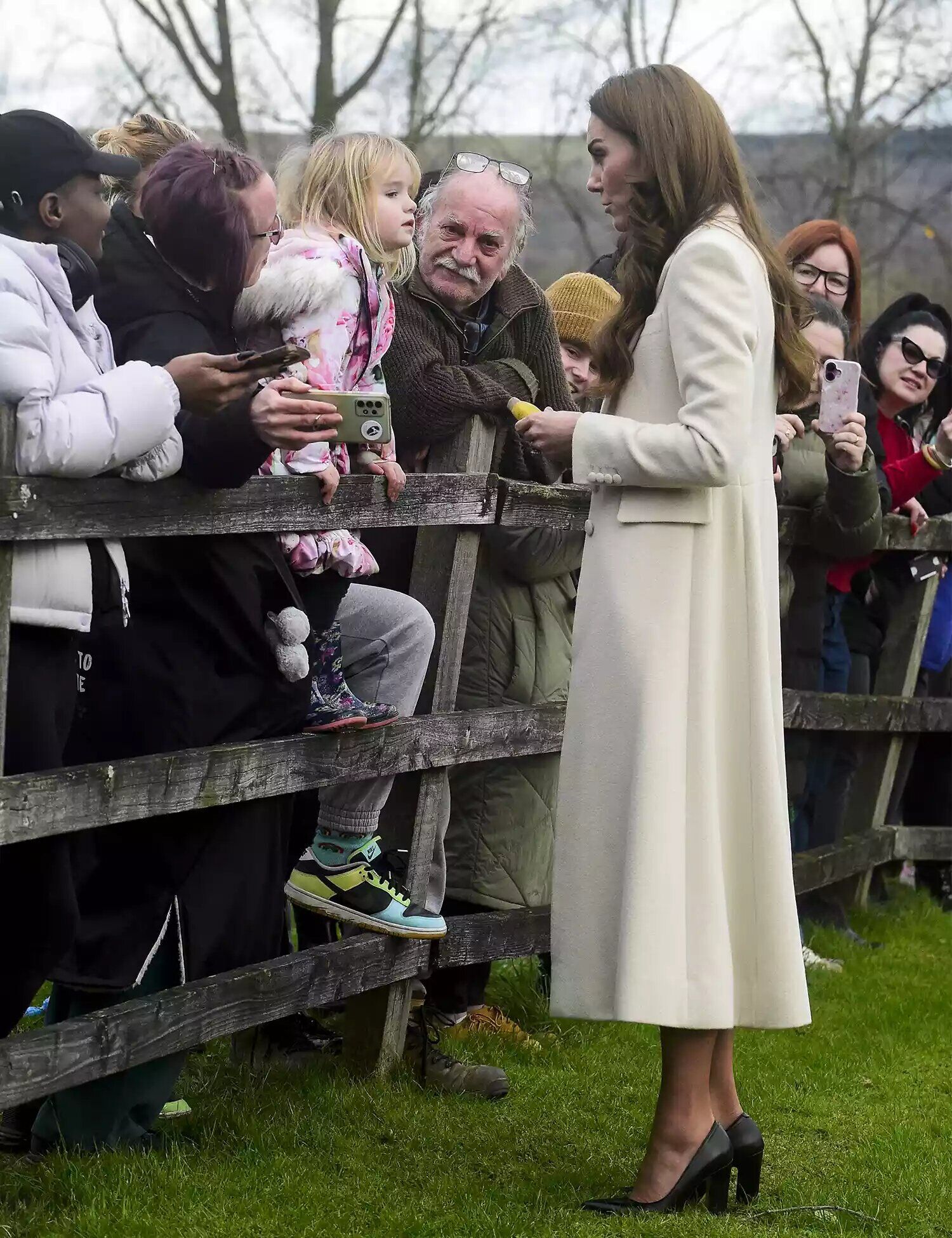 Catherine, Princess of Wales (R) meets members of the public during a visit to Corgi, a family run textiles manufacturer focused on the production of socks and knitwear on Jan. 30, 2025 in Ammanford, Wales.