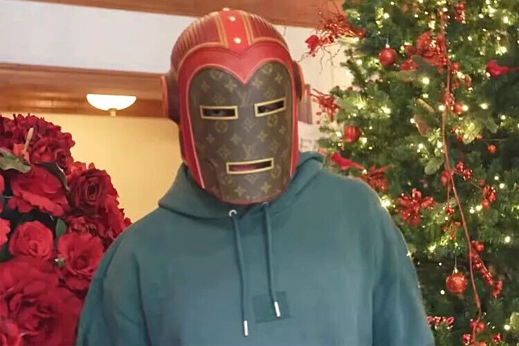 Nick Cannon wearing his Louis Vuitton Iron Man helmet.