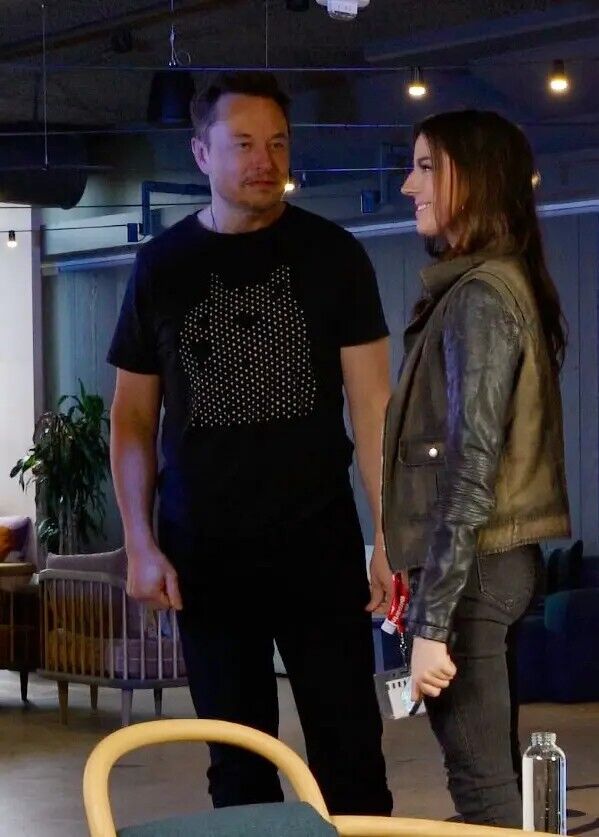 Elon Musk talks with Ashley St. Clair in 2023.