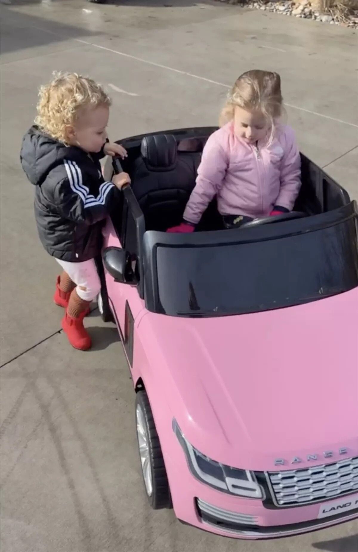 Bronze and Sterling Mahomes in Sterling's mini pink Range Rover.