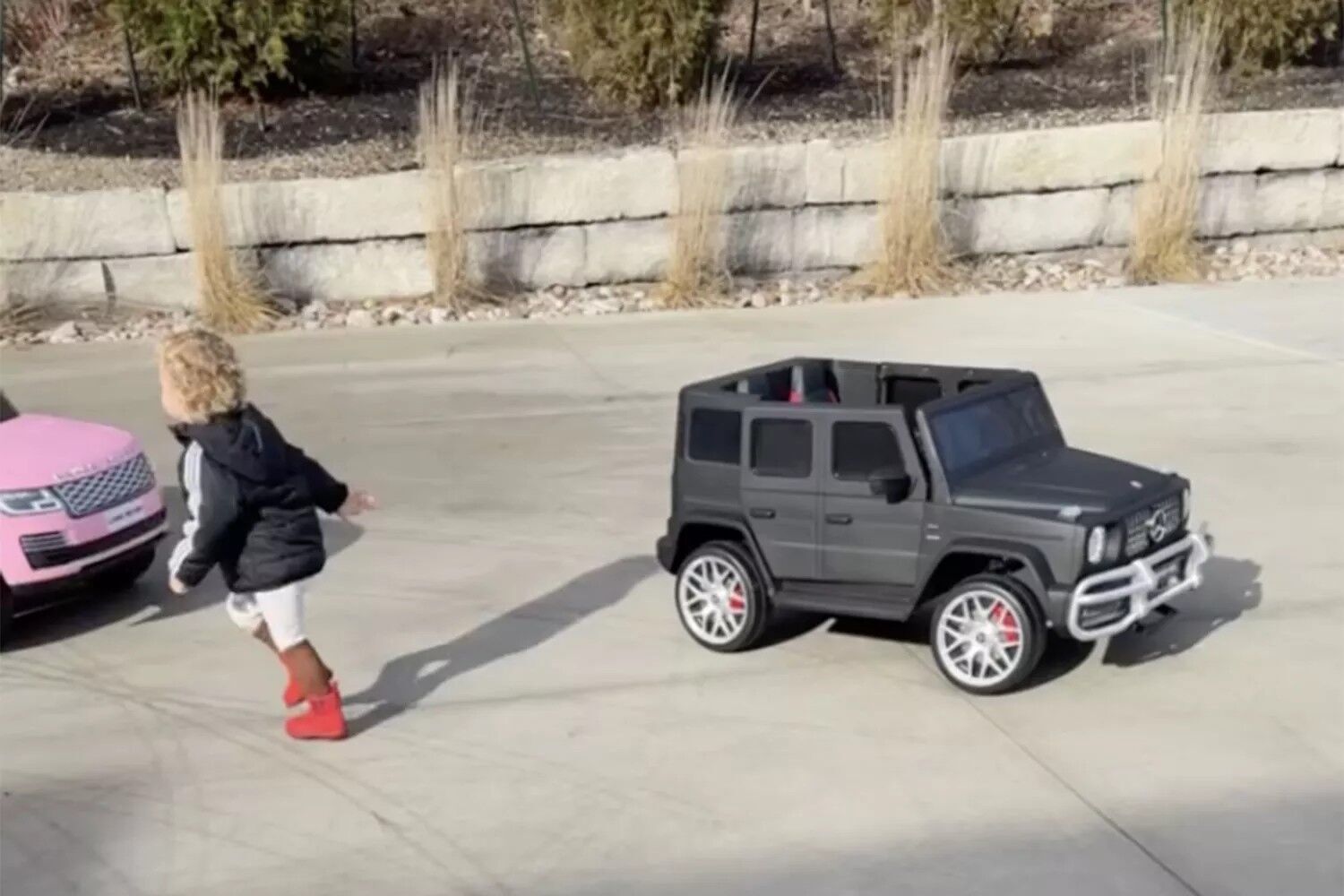 Bronze and his matte black Mercedes G-Wagon.