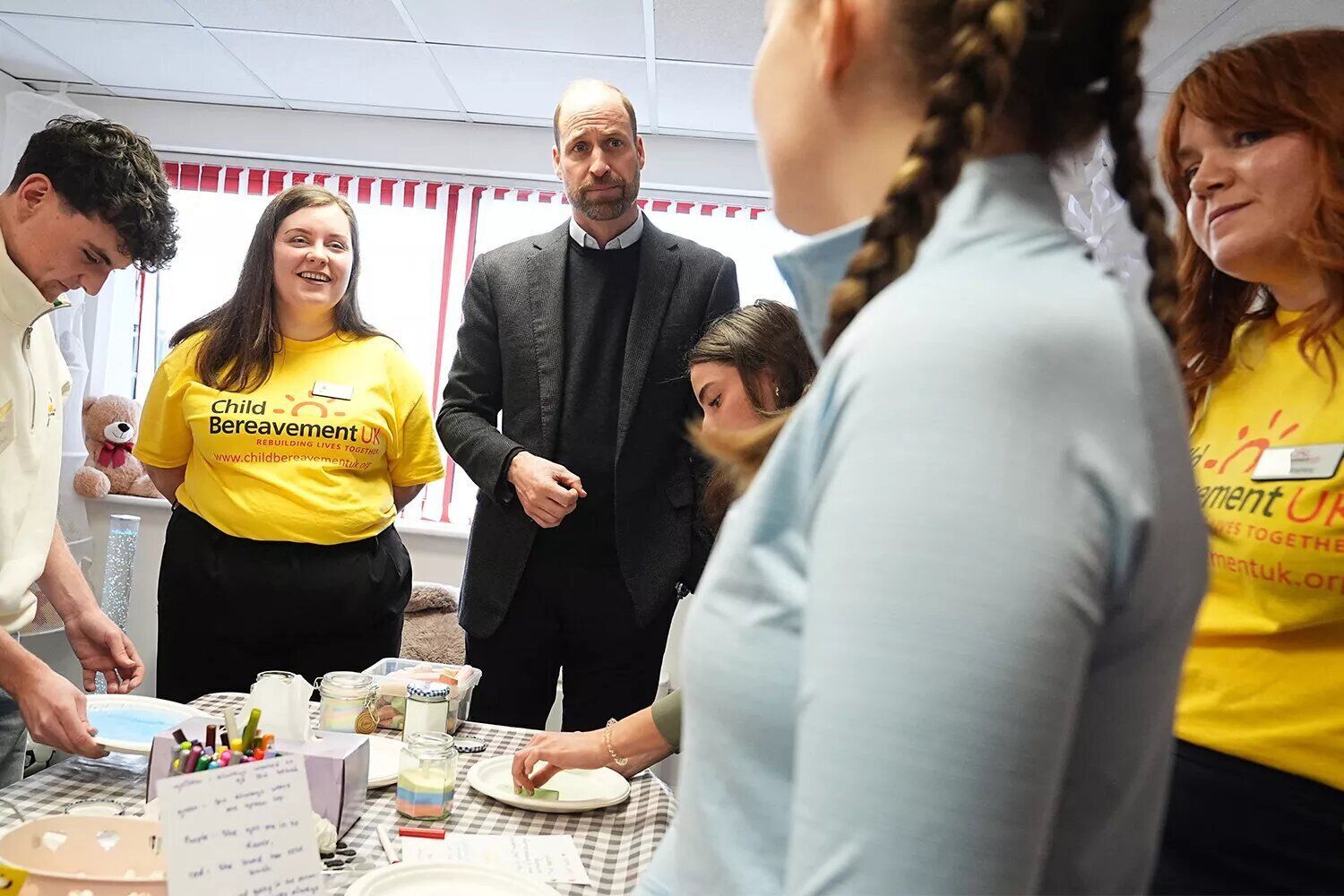 Prince William, Prince of Wales, talks with children who have been supported by the Child Bereavement UK charity