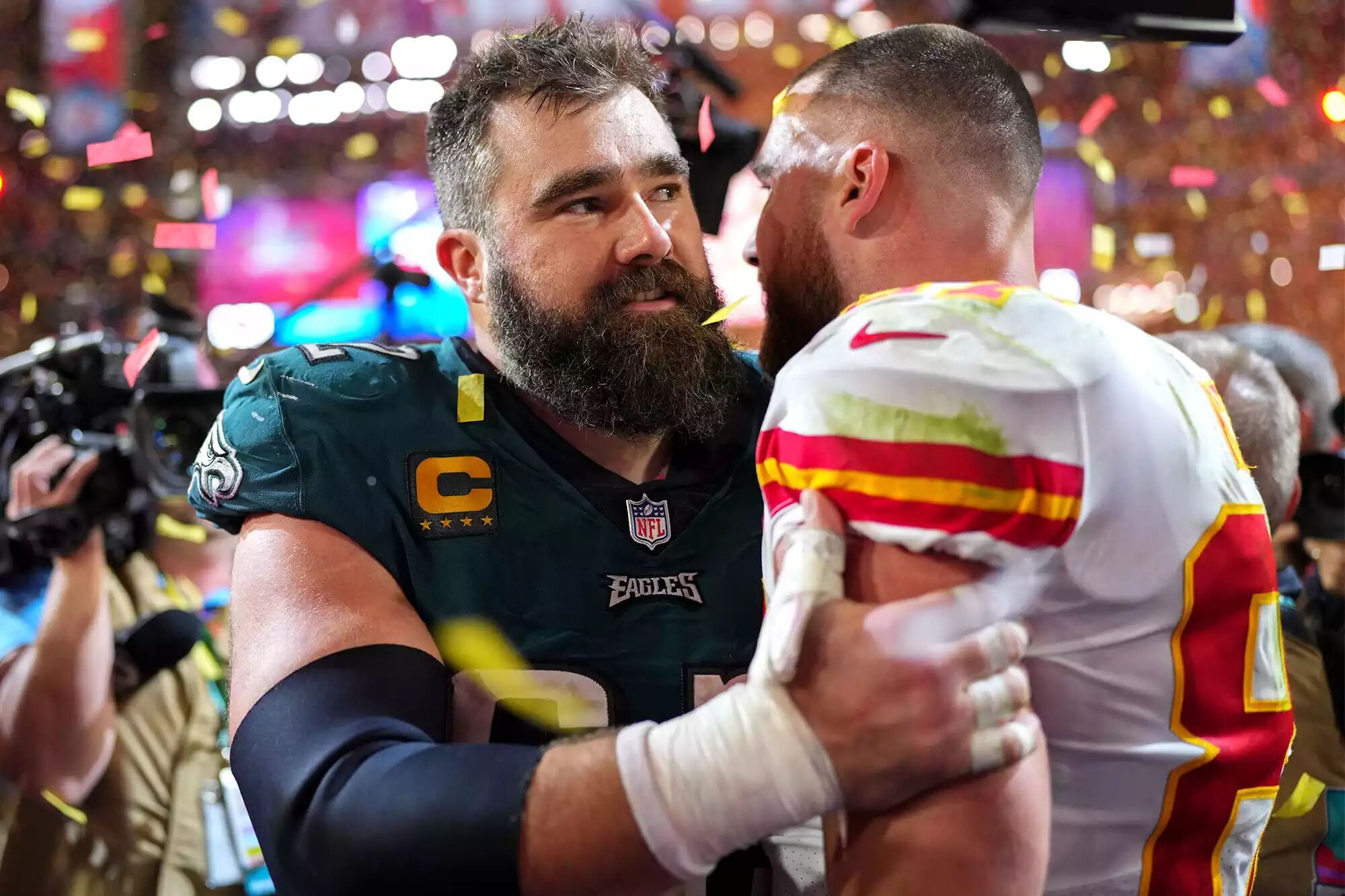 Jason and Travis Kelce on the field.