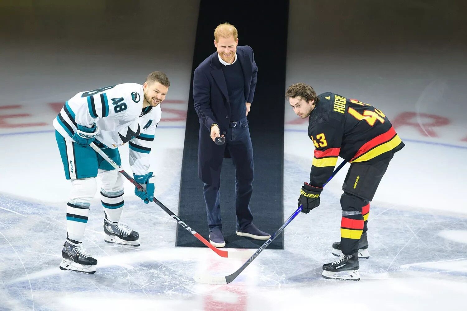 Prince Harry drops the puck during a NHL game ceremonial face-off on Nov. 20, 2023.