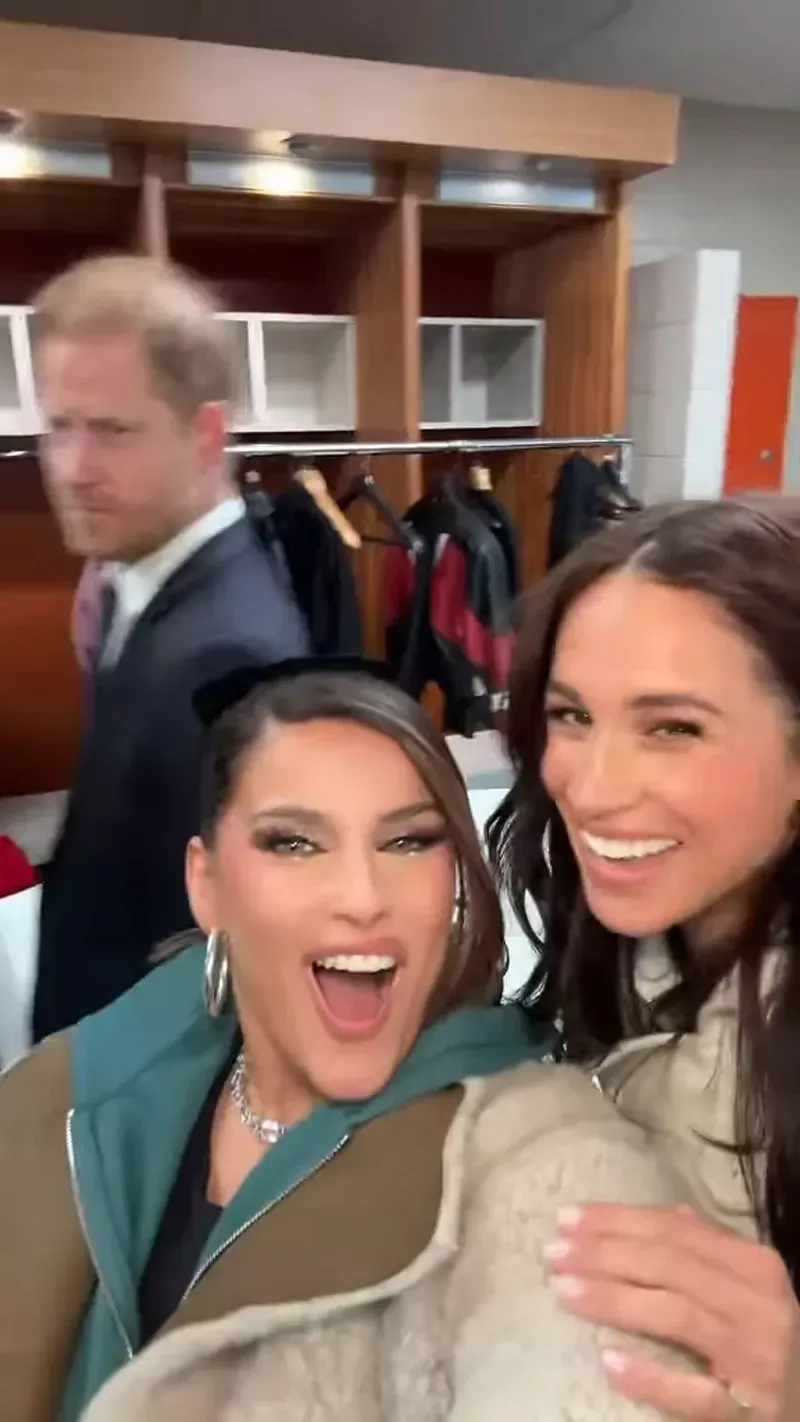 Meghan Markle and Nelly Furtado Strike a Pose with Prince Harry’s Photobomb