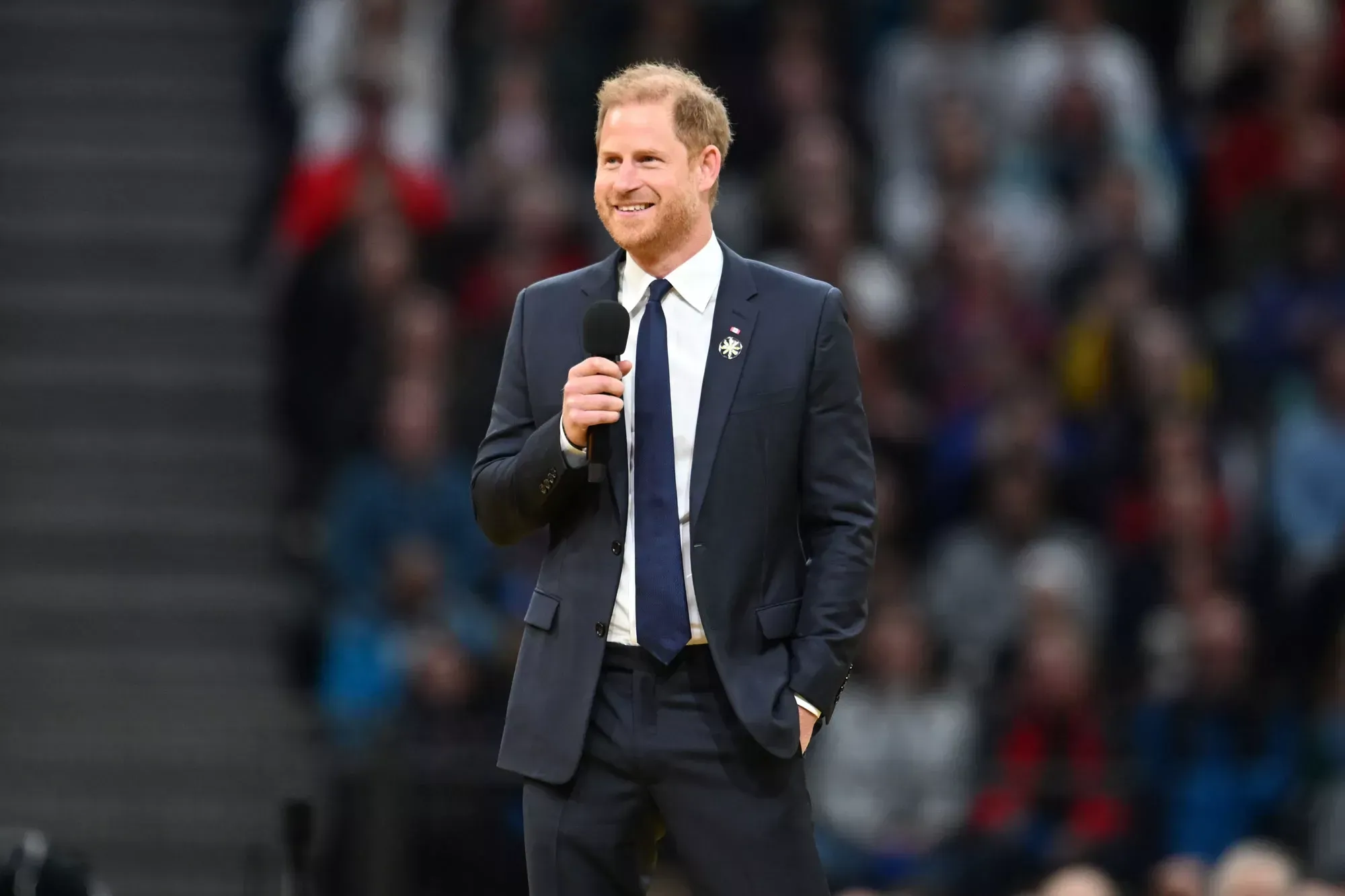 Meghan Markle and Nelly Furtado Strike a Pose with Prince Harry’s Photobomb