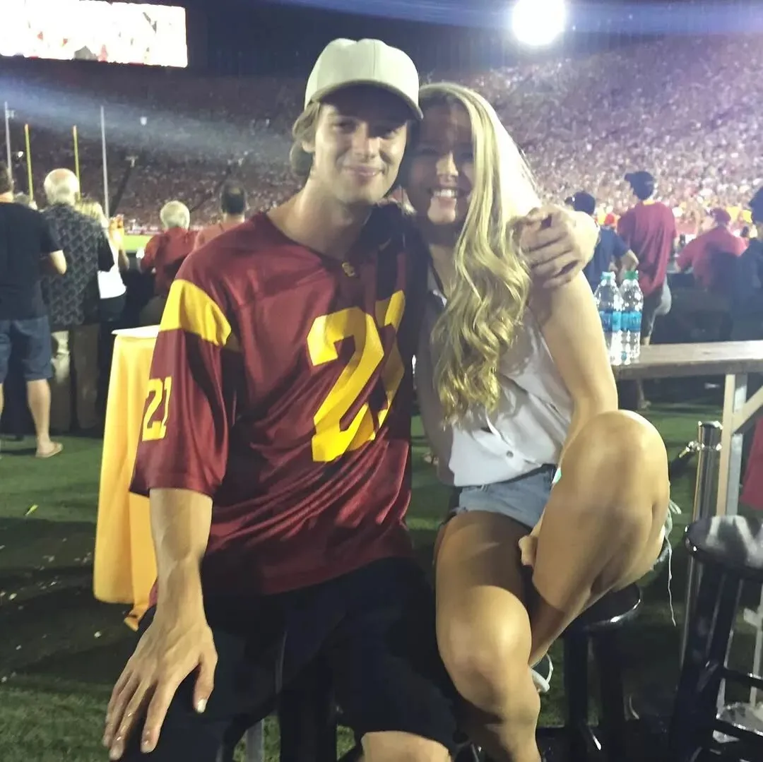 Throwback image of Patrick Schwarzenegger and Abby Champion at a football game.