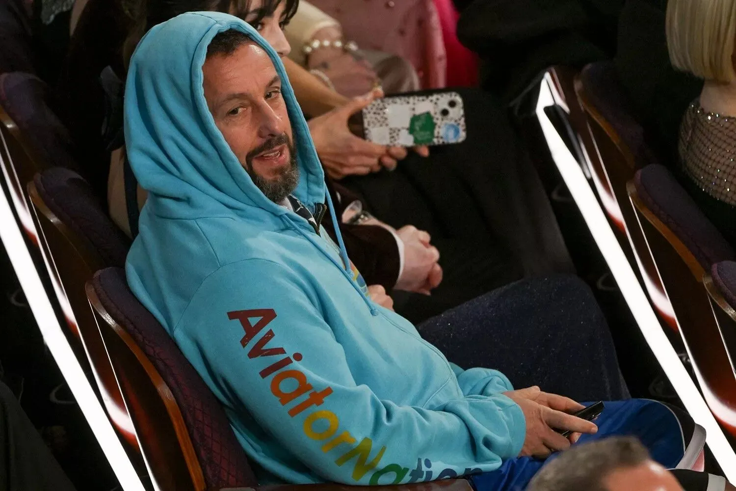 Adam Sandler Crashes the 2025 Oscars in a Hoodie and Basketball Shorts ...