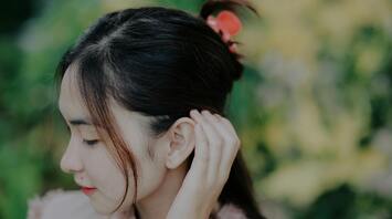 What does a burning ear mean?
