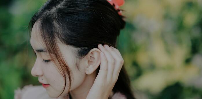 What does a burning ear mean?