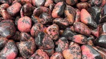 11 Spiritual Meanings of Rhodonite
