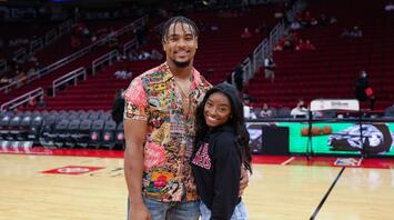 Simone Biles and Jonathan Owens Receive Personalized Jerseys at a Chicago Bulls Game