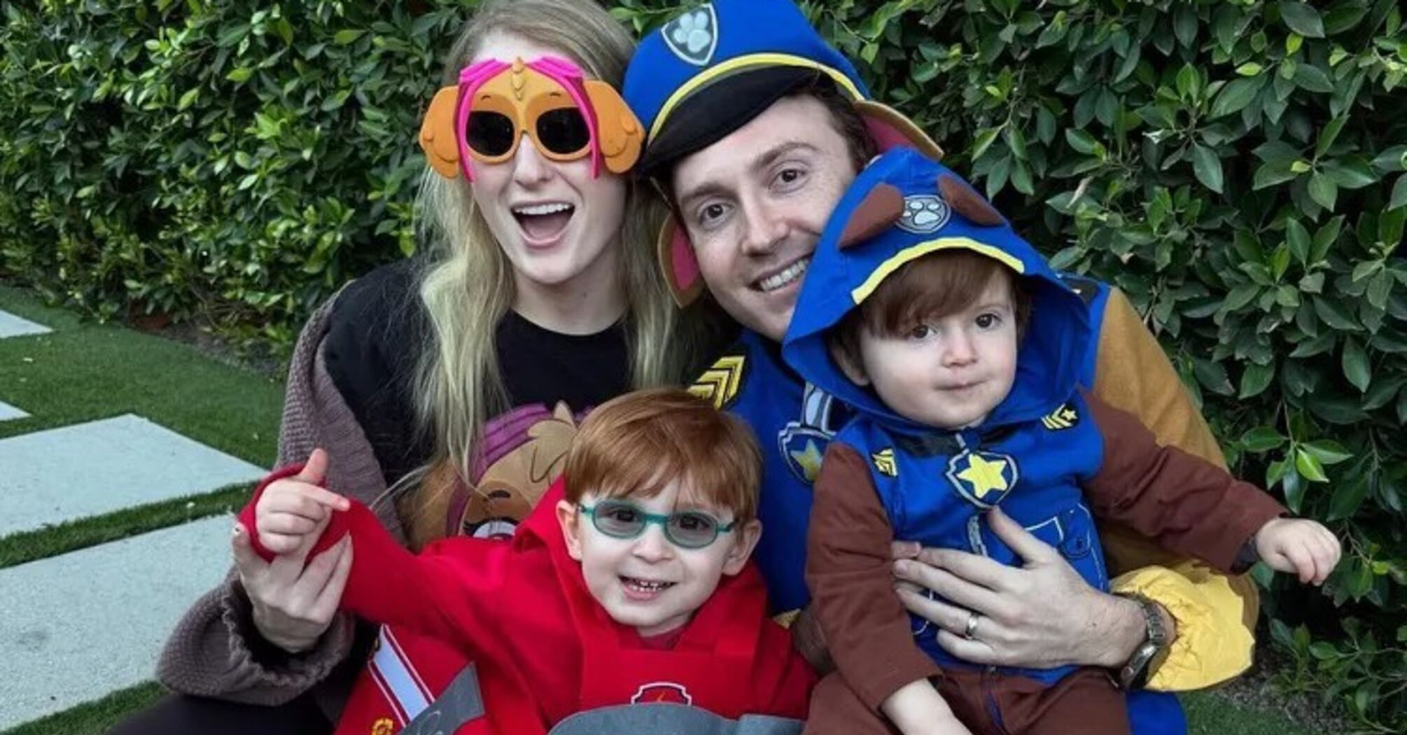 Meghan Trainor and Daryl Sabara, pictured with their children