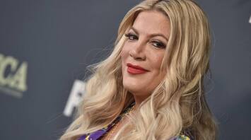 Tori Spelling Recalls Kissing John Corbett on New Year's Eve