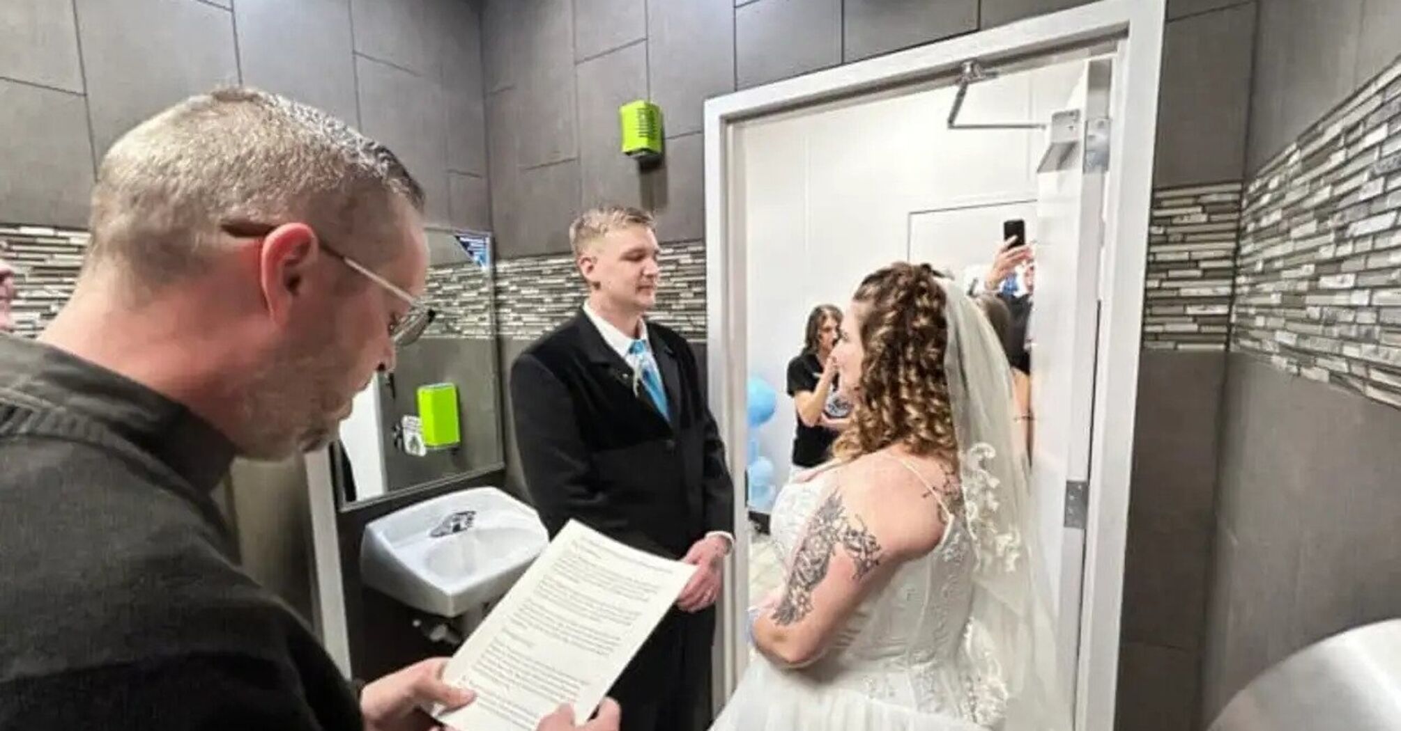 The couple held their wedding in a gas station restroom