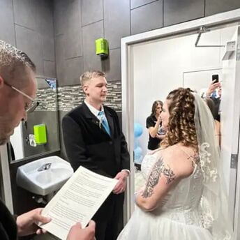 The couple held their wedding in a gas station restroom