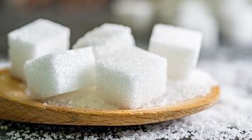 Why sprinkle a pinch of sugar on food in the oven