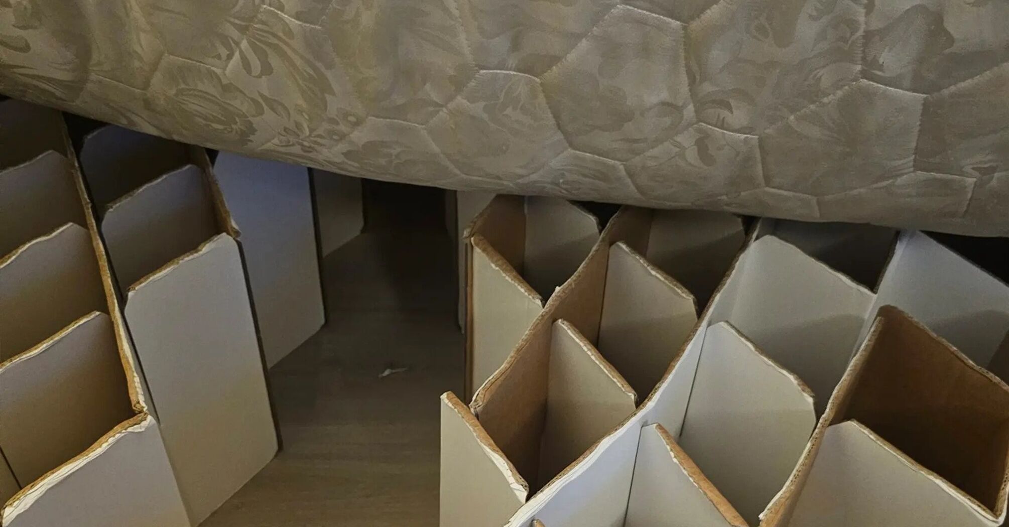 Guest arrives at hotel reservation to discover a cardboard ‘dungeon’ bed