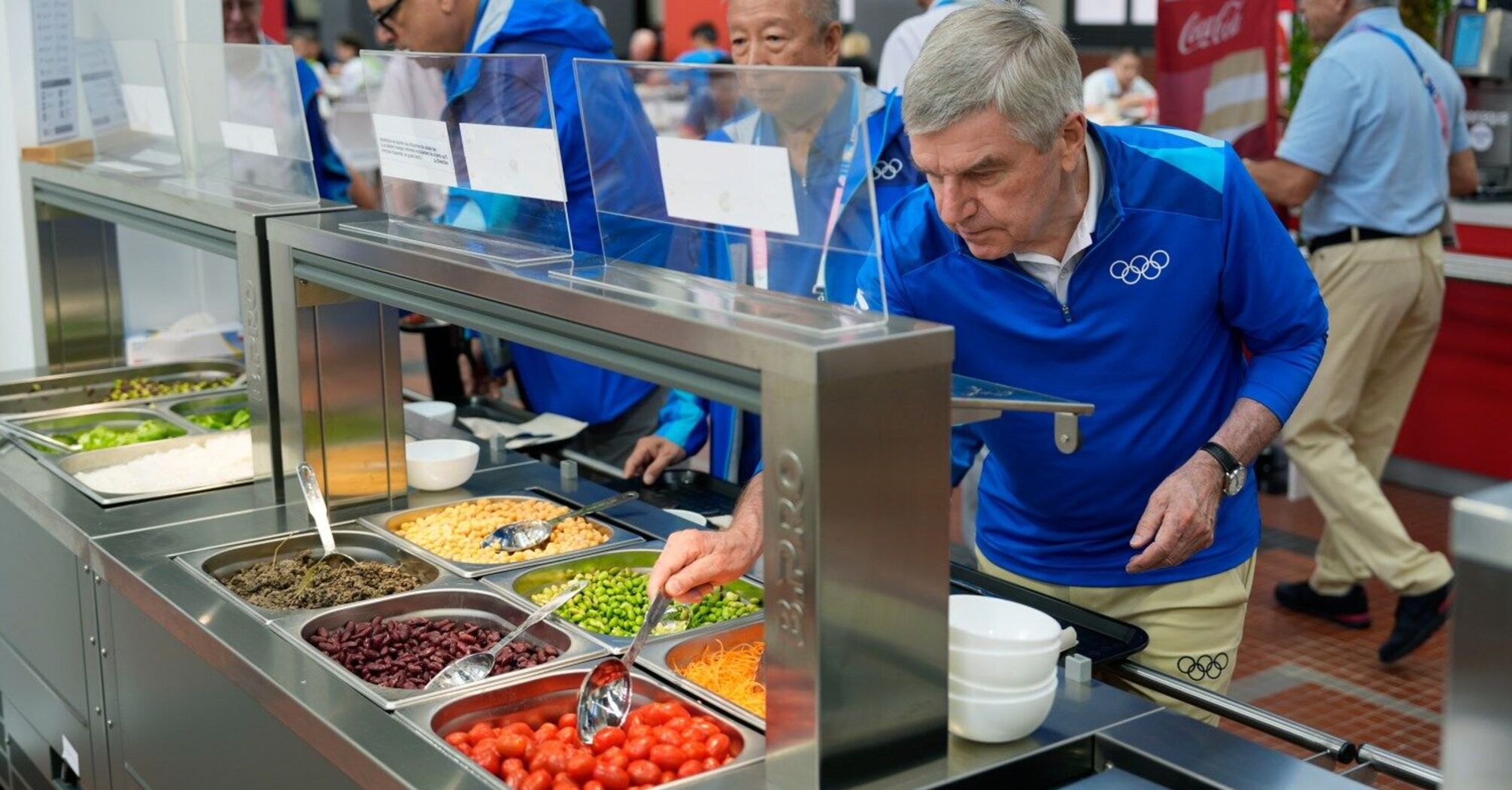 IOC President Thomas Bach tries food 