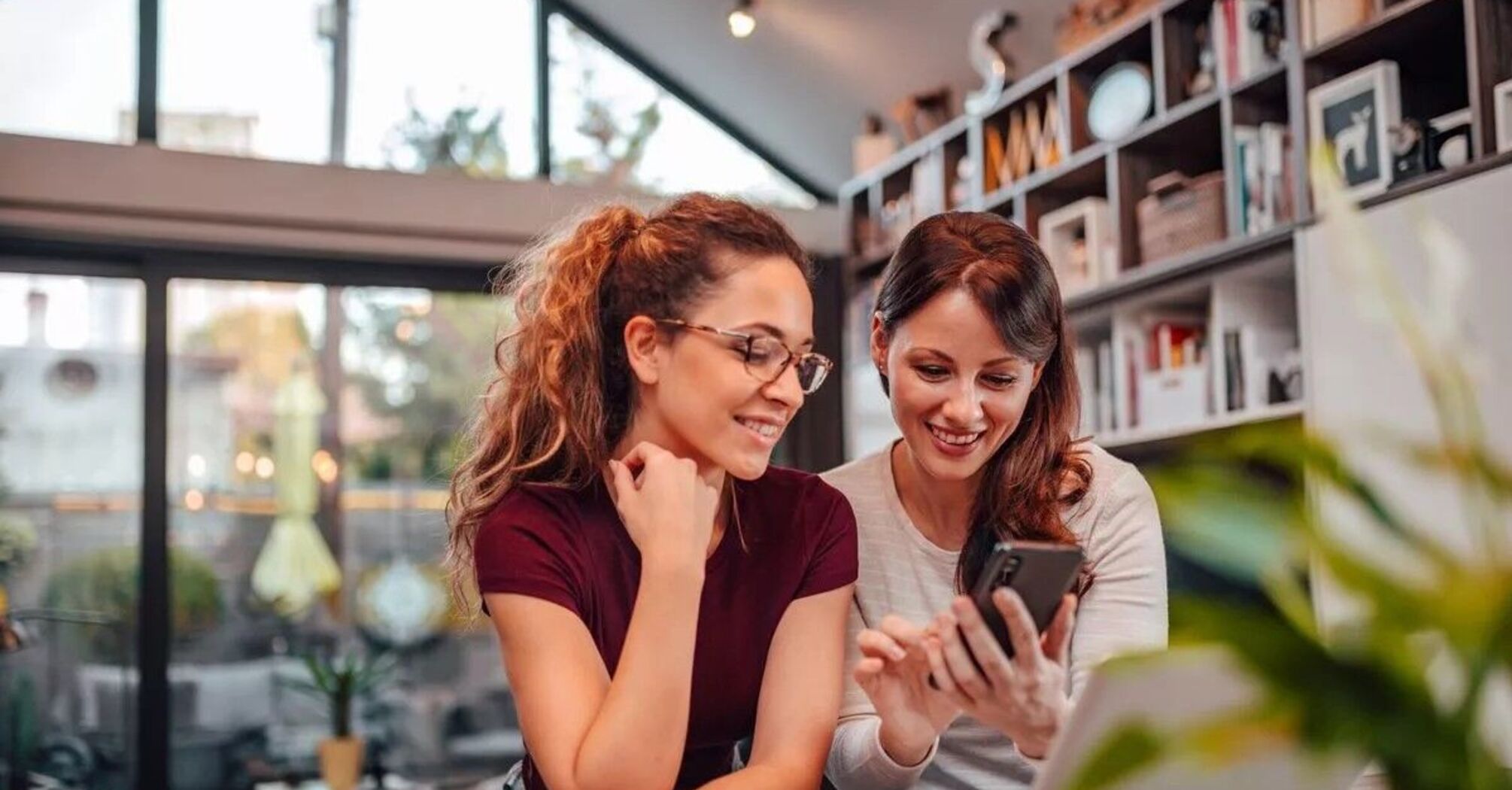 Two women looking at the phone