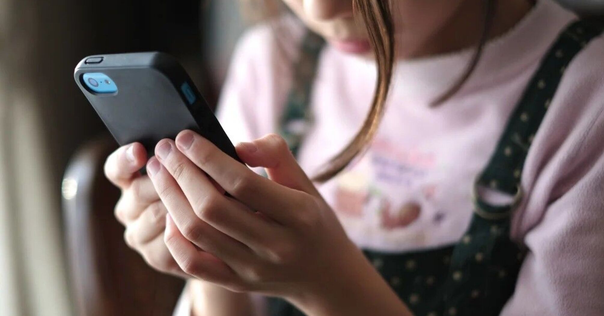 A child with a phone