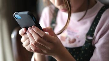 A child with a phone